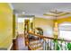 Hallway features chandelier, hardwood floors, and an iron railing staircase at 1214 Greenridge Ln, Lithonia, GA 30058