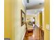 This hallway has hardwood floors, chair rail molding, and multiple doorways to other rooms at 1214 Greenridge Ln, Lithonia, GA 30058
