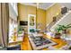 Elegant living room with high ceilings, a fireplace, hardwood floors, and staircase access at 1214 Greenridge Ln, Lithonia, GA 30058