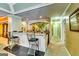 This wet bar features tile flooring and seating, and is well-lit by recessed lighting at 1214 Greenridge Ln, Lithonia, GA 30058