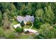 Aerial view of a stunning property nestled among lush trees, featuring a private driveway at 2275 Honeysuckle Se Ln, Smyrna, GA 30080