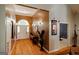 Inviting foyer with hardwood floors, decorative console table and decoratively painted walls at 2275 Honeysuckle Se Ln, Smyrna, GA 30080