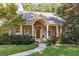 Inviting front porch with brick pillars and arched windows, offering a cozy outdoor space at 2275 Honeysuckle Se Ln, Smyrna, GA 30080