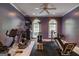 Bright home gym equipped with various exercise machines and ample natural light from arched windows at 2275 Honeysuckle Se Ln, Smyrna, GA 30080