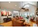 Spacious living room featuring vaulted ceiling, fan, hardwood floors, fireplace and comfortable seating at 2275 Honeysuckle Se Ln, Smyrna, GA 30080