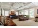 Expansive main bedroom with coffered ceiling, many windows, and sitting area with couches at 2275 Honeysuckle Se Ln, Smyrna, GA 30080