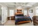 Well-lit main bedroom with a large bed and painting hanging over it at 2275 Honeysuckle Se Ln, Smyrna, GA 30080