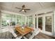 Screened-in porch featuring vaulted ceilings, ceiling fan and wood flooring at 2275 Honeysuckle Se Ln, Smyrna, GA 30080