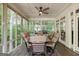 Screened-in porch featuring vaulted ceilings, ceiling fan and wood flooring at 2275 Honeysuckle Se Ln, Smyrna, GA 30080