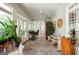 Bright sunroom with tile floor, ceiling fan, and view to exterior at 2275 Honeysuckle Se Ln, Smyrna, GA 30080