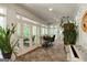 Bright sunroom with tile floor, ceiling fan, and view to exterior at 2275 Honeysuckle Se Ln, Smyrna, GA 30080