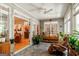 Bright sunroom with gray tile floors, ceiling fan, and view into the adjacent rooms at 2275 Honeysuckle Se Ln, Smyrna, GA 30080