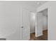 Bright hallway with a view into an open bathroom; neutral walls and wood-look flooring at 7254 Crestside Dr # 71, Austell, GA 30168