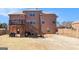 A spacious fenced backyard with a multi-level deck and brick exterior home at 124 Shelton Dr, Mcdonough, GA 30252