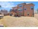 Large grassy backyard with a multi-level deck and brick exterior home at 124 Shelton Dr, Mcdonough, GA 30252