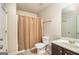 Neutral bathroom with a shower curtain, a vanity, and modern fixtures, providing a functional space at 124 Shelton Dr, Mcdonough, GA 30252