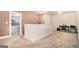 Spacious bonus room with a partition, neutral carpet, and ample space for various activities or storage at 124 Shelton Dr, Mcdonough, GA 30252
