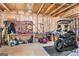 Garage featuring pegboard wall storage, motorcycle and workspace area at 124 Shelton Dr, Mcdonough, GA 30252
