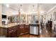 Open kitchen with a granite-topped island and stainless steel appliances at 124 Shelton Dr, Mcdonough, GA 30252