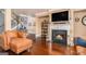 Inviting living room with hardwood floors, fireplace, and comfortable seating at 124 Shelton Dr, Mcdonough, GA 30252