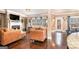 Open living room with fireplace, large windows, and view into breakfast nook and kitchen at 124 Shelton Dr, Mcdonough, GA 30252