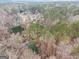 Aerial view of a home nestled among dense trees and foliage at 620 Bell Se Rd, Conyers, GA 30094
