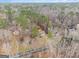 Aerial view showing property near a road and among dense trees and vegetation at 620 Bell Se Rd, Conyers, GA 30094