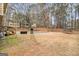 Exterior view of a covered pool, deck and a trampoline at 620 Bell Se Rd, Conyers, GA 30094