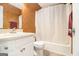 Bathroom features a white vanity, toilet, and a shower/tub combination at 620 Bell Se Rd, Conyers, GA 30094