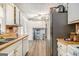 Kitchen with stainless steel appliances, white cabinetry, modern appliances, and lots of space for storage at 620 Bell Se Rd, Conyers, GA 30094