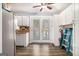 Bright kitchen featuring white cabinets, wood countertops, modern appliances, and a door to the backyard at 620 Bell Se Rd, Conyers, GA 30094