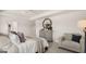 Cozy bedroom featuring a comfortable sitting chair, dresser, and soothing color scheme at 615 Edgar St # 13, Hampton, GA 30228