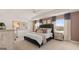 Well-lit bedroom featuring a tray ceiling, coordinating curtains, and plush bedding at 615 Edgar St # 13, Hampton, GA 30228