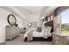 Spacious bedroom featuring soft carpet, a sitting area, and ample natural light streaming through the windows at 615 Edgar St # 13, Hampton, GA 30228