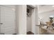 Open closet displaying functional storage space and easy access to a naturally lit dining room at 615 Edgar St # 13, Hampton, GA 30228