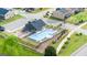 Aerial view of the community pool and clubhouse in a beautifully landscaped setting at 615 Edgar St # 13, Hampton, GA 30228