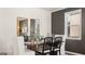 Elegant dining room featuring modern decor, stylish chairs, and a view through the window at 615 Edgar St # 13, Hampton, GA 30228