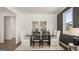 Inviting dining room with neutral tones, contemporary table setting, and natural light from the window at 615 Edgar St # 13, Hampton, GA 30228