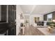 Inviting entryway with hardwood floors, a black front door, and a view of the dining room at 615 Edgar St # 13, Hampton, GA 30228