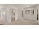 A hallway is shown with neutral decor and multiple doorways at 615 Edgar St # 13, Hampton, GA 30228