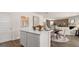 Bright kitchen island with white countertops and wooden accents, perfect for casual dining and entertaining at 615 Edgar St # 13, Hampton, GA 30228
