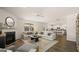 Inviting living room featuring a cozy fireplace, plush seating, and neutral tones for a relaxing atmosphere at 615 Edgar St # 13, Hampton, GA 30228