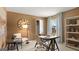 Well-lit office space with a large clock and organized bookshelves at 615 Edgar St # 13, Hampton, GA 30228