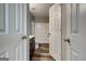 Bathroom featuring wood-look flooring, a dark vanity, and a shower-tub combo at 6746 Lake Erie Ln, Fairburn, GA 30213