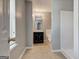 Hallway bathroom featuring a single vanity and tile floors at 6746 Lake Erie Ln, Fairburn, GA 30213