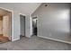 Bedroom boasts neutral carpet, access to bathroom, closet, and bonus room at 6746 Lake Erie Ln, Fairburn, GA 30213