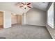 Spacious bedroom featuring plush carpeting, large windows, and a ceiling fan at 6746 Lake Erie Ln, Fairburn, GA 30213