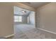 Bedroom featuring neutral paint, carpeted floors, a ceiling fan, and an attached bathroom at 6746 Lake Erie Ln, Fairburn, GA 30213