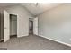 Bedroom with a vaulted ceiling, plush carpeting, walk-in closet, and adjacent room at 6746 Lake Erie Ln, Fairburn, GA 30213