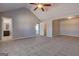 Bright bedroom with vaulted ceiling, ceiling fan and neutral carpeted floors at 6746 Lake Erie Ln, Fairburn, GA 30213